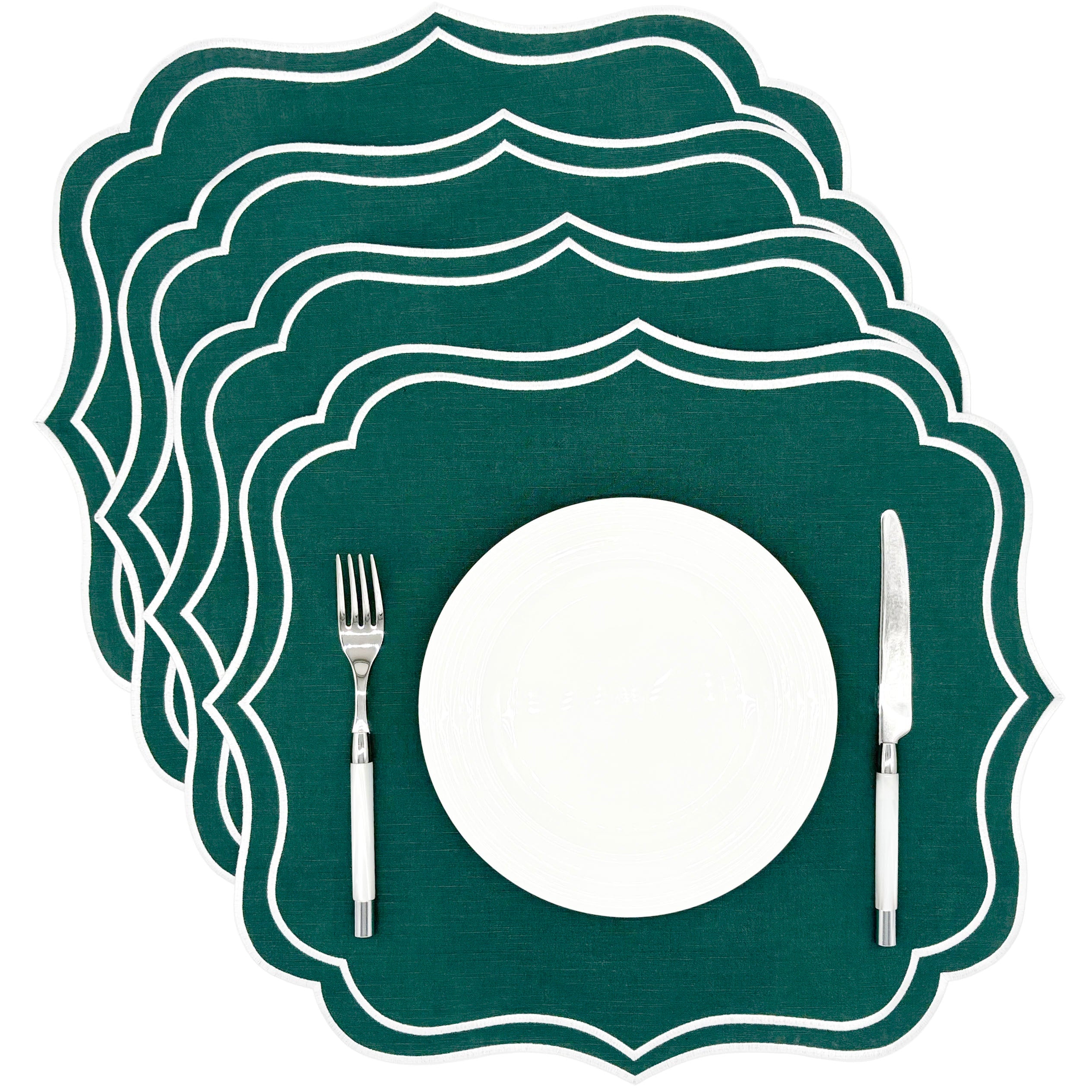 Four green Charlotte scalloped placemats with white embroidered edge, stacked, included in the set