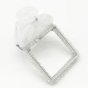 Close-up of the white beaded Pebble Stone napkin ring included in the set