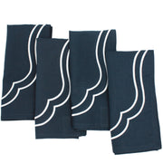 Flat lay of navy Charlotte cotton linen napkins with white scallop embroidery included in the set
