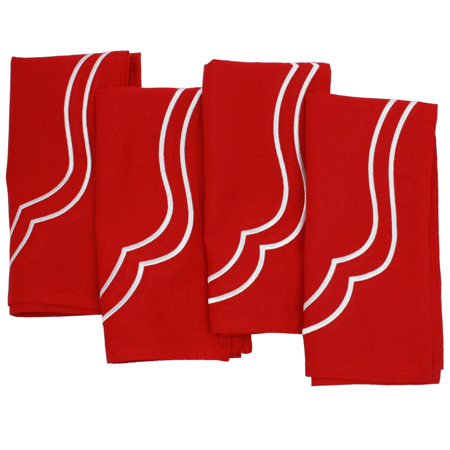 Flat lay of four red Charlotte cotton linen napkins with white scallop embroidery included in the set