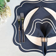 Navy Charlotte embroidered napkin on a navy scalloped Charlotte placemat