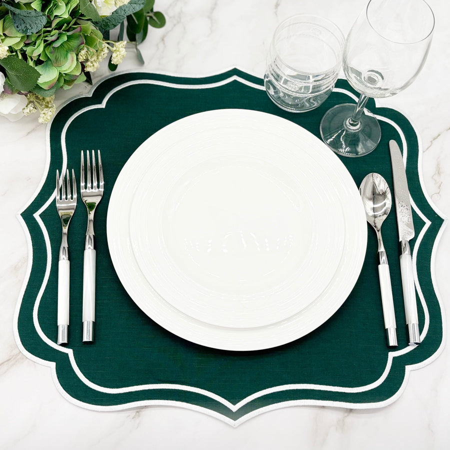 Christmas Table Set for 4 (Green & Ivory Gold): green Charlotte scalloped placemat with white embroidered edge, set with white plates, silver flatware and glassware