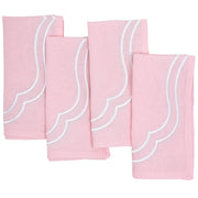 Four light pink Charlotte cotton linen napkins with white scallop embroidery, laid flat