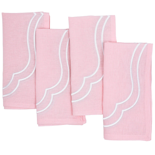 Four light pink Charlotte cotton linen napkins with white scallop embroidery, laid flat